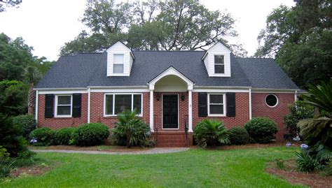 pic of red brick house with metal roof|brick homes with metal roofs.